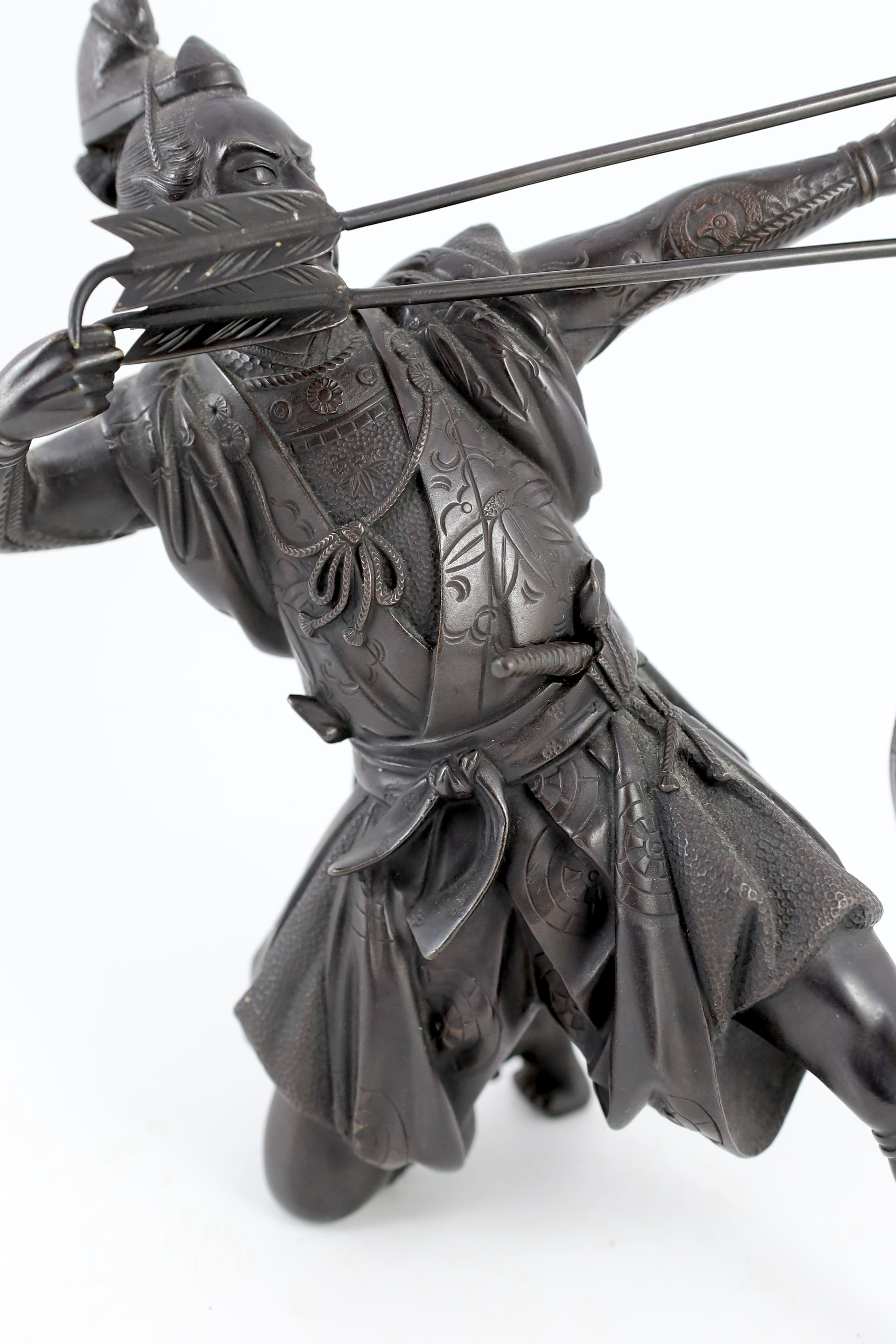 A Japanese bronze figure of a kneeling archer, Meiji period, 40 cm high